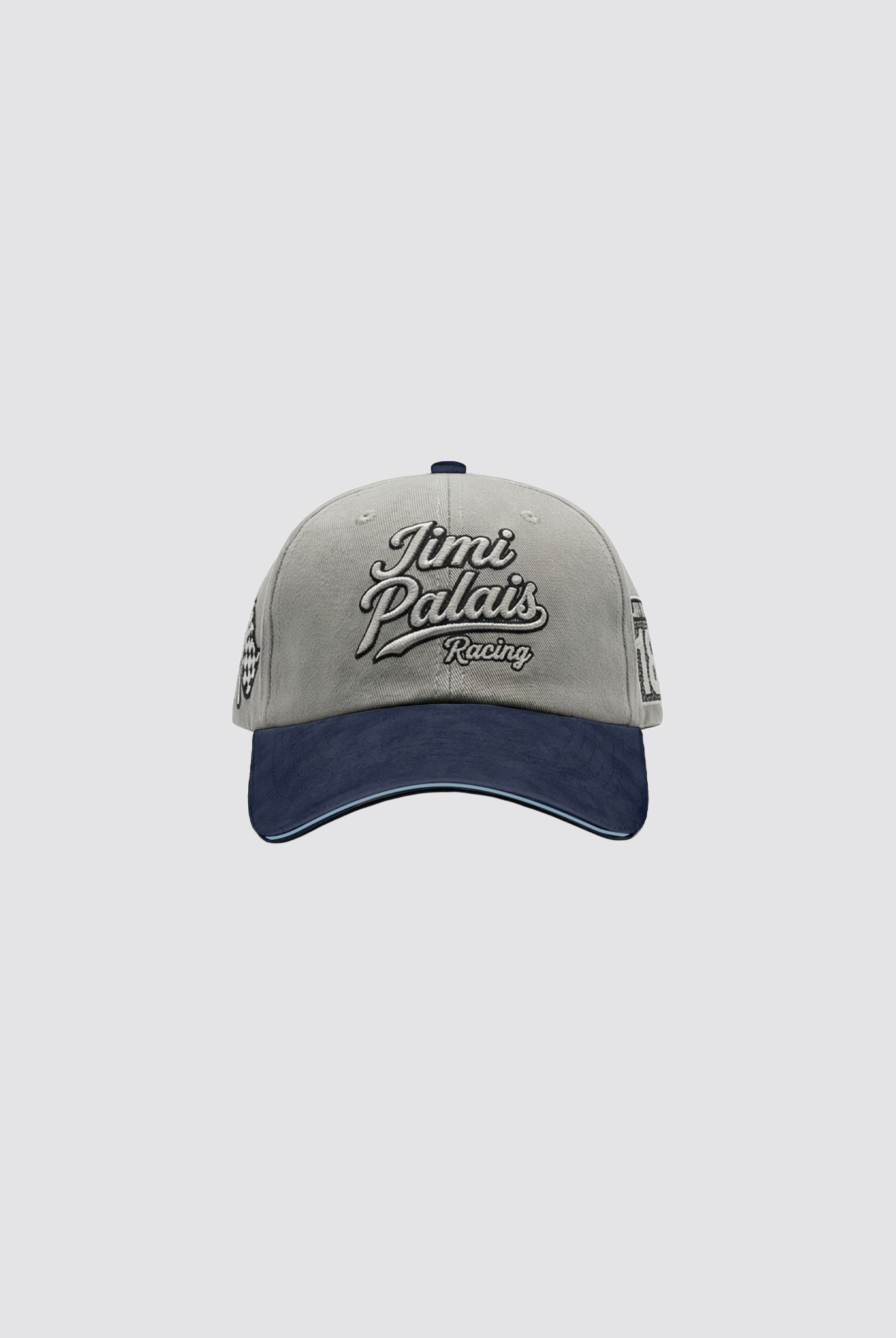 Graue Cap mit navy Schirm und gestickten Applikationen auf der Vorderseite