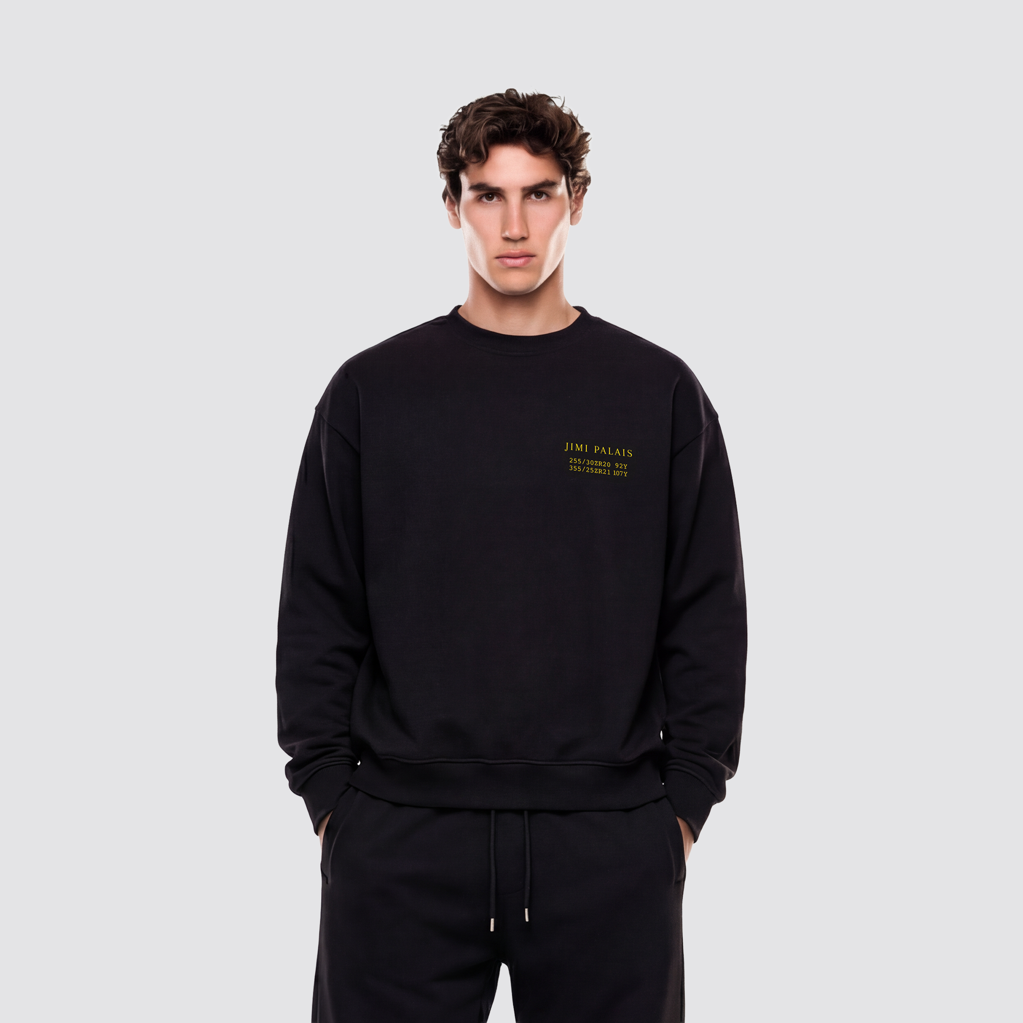 Schwarzer Baumwollpullover mit Applikationen und Frontprint auf der Vorderseite