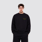 Schwarzer Baumwollpullover mit Applikationen und Frontprint auf der Vorderseite